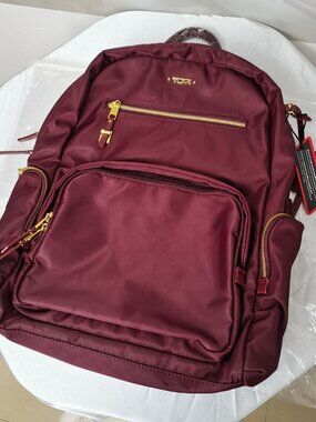 Tumi Burgundy Crossbody Backpack with Gold Hardware